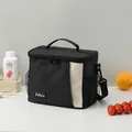Borsa termica nera e beige con tracolla e tasche laterali in rete per il pranzo. - Nero