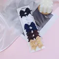 Set of 10 mini grosgrain ribbon bow hair clips in 5 assorted colors for baby girls - Black White Navy Series