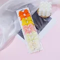 Eight mini grosgrain ribbon butterfly hair bows in candy colors on white display card - Orange Yellow Pink White Mixed