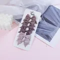 Set of six mini grosgrain ribbon bow hair clips for kids in various dusty rose tones - Morandi Pink Series