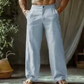 Detailed shot of men's light blue linen beach pants with button waist and straight leg - Light Blue