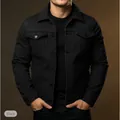 Detailed view of a men's slim fit black denim workwear jacket with chest pockets - S / Tops / Black