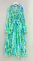 Close-up detail of the ruffle sleeves and rhinestone trim on a floral print maxi dress - S / Top And Bottom / Sky Blue
