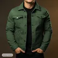 Close-up detail of men's slim fit army green denim jacket featuring buttoned chest pockets - S / Tops / Army Green