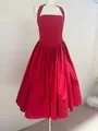 Detail of vibrant red halter neck dress with elegant pleated skirt design - S / Top And Bottom / Red