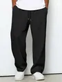Λεπτομερής προβολή του μαύρου ανδρικού παντελονιού waffle με ανάγλυφη υφή και φαρδιά γραμμή - S / Bottoms / Μαύρο