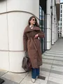 Street style view of a long brown puffer coat with tie-belt and quilted texture - S / Tops / Coffee