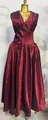 Close-up of elegant wine red pleated French maxi dress with shimmering fabric - S / Top And Bottom / Burgundy