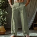 Detail view of men's breathable sage green linen straight-leg beach pants with pockets - Green