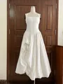 Detailed view of the white French romantic halter dress featuring a pleated bodice and corset waist - S / Tops / White
