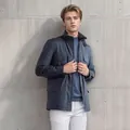 Detail view of men's blue vintage workwear jacket with functional multi-pocket design - S / Tops / Blue