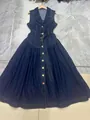 Full view of a dark blue sleeveless denim dress with a belted waist and shirt collar. - S / Long Style (Bottom) / Blue