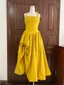 Detail of a yellow French halter pleated dress with waist-slimming asymmetrical design. - Gold Yellow