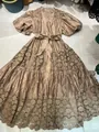 Close-up view of French style champagne maxi dress featuring intricate floral lace embroidery - Khaki