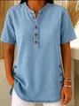Close-up of buttoned notch neckline and side details on light blue denim t-shirt - Light Blue