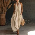 Elegant beige sleeveless linen maxi dress featuring a halter neck and convenient pockets - S / Top And Bottom / Khaki