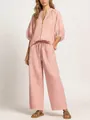 Detail shot of a dusty pink casual two-piece set featuring a zipper top and wide-leg pants - Pink