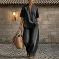 Completo estivo da donna in denim con top scollo a V e pantaloni larghi color nero. - Nero
