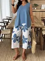 Completo elegante da donna con top senza maniche blu e pantaloni con stampa floreale - Celeste
