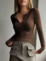 Detailed view of brown ribbed texture and slim fit henley neckline on women's knit top - Dark Brown