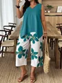 Elegante completo donna con top senza maniche blu e pantaloni capri con stampa floreale - Ciano
