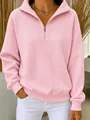 Gros plan détaillé d'un sweat-shirt pour femme en maille gaufrée rose avec col zippé - S / Hauts / Rose