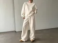 Set due pezzi minimalista premium con felpa color crema e pantaloni larghi casual da donna - Albicocca