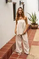 Detail shot showing the soft texture of a beige tube top and wide-leg trousers set - S / Top And Bottom / Off White
