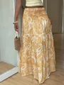 Dettaglio della gonna maxi gialla con stampa paisley, balze e vita elasticizzata - Taglia S / Pantaloni e gonne / Giallo