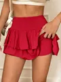 High-waisted solid red layered athletic skort with built-in shorts for active summer fashion - S / Bottoms / Red