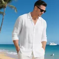 Stylish men's white linen long-sleeve beach shirt worn by a model at a resort - S / Tops / White
