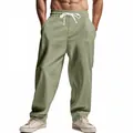 Detailed view of men's loose light green linen casual pants with drawstring waist - Green