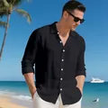 Detailed view of a men's black linen long sleeve beach shirt against a tropical coast - S / Tops / Black