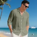 Detailed view of a men's olive green linen long sleeve shirt in a beach setting - S / Tops / Army Green
