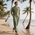 Hombre caminando por la playa con un conjunto de camisa y pantalón de lino verde - Verde Militar