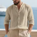 Close-up of a men's beige linen Henley shirt with stand collar on model - S / Tops / Khaki