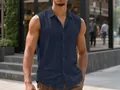 Close-up of a men's navy blue sleeveless linen shirt in a casual urban setting - Navy Blue
