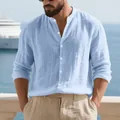 Close-up of men's light blue stand collar linen long sleeve shirt in coastal setting - S / Tops / Light Blue