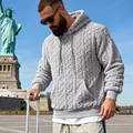 Detailed view of men's grey jacquard teddy fleece hoodie in an outdoor travel setting - S / Tops / Gray
