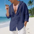 Detail of men's blue linen hooded shirt with crinkled texture and button front on beach - S / Tops / Navy Blue
