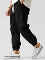 Men's loose black linen casual joggers with drawstring waist and cuffed ankles - S / Bottoms / Black