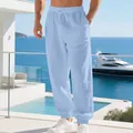 Comfortable light blue breathable linen cotton joggers for men in a summer resort setting. - Light Blue