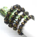 Detailed macro view of black obsidian mantra beads with golden Buddhist engravings. - Pure Mantra Bead Bracelet / 8mm