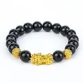 Close-up view of the black obsidian beads and golden Pixiu charm on a spiritual bracelet. - Golden Beads PiXiu Bracelet / 12mm