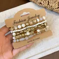 Six-piece vintage bohemian beaded bracelet set featuring golden beads and white accents - Five-Piece Set / Gold-White