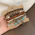 Detailed close-up of Bohemian multi-layer bracelet set with wooden and turquoise beads - Silver Brown Orange Feather (6-Piece Set)