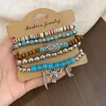 Detail van een bohemian kralenarmbandset met turquoise kralen en western bedels - Blauw Bruin Zilver Ossenkop (5-delige set)