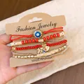 Bohemian style multi-layer red bead bracelet set featuring evil eye and hamsa hand charms - Hamsa Hand / 6-Piece Set / Red