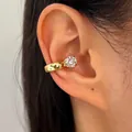 Elegant gold-tone ear cuff featuring a sparkling round cubic zirconia, worn on ear. - Right Ear (1 Piece) / Gold