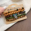 Handmade ethnic wooden bead bracelet set with silver Hamsa hand charm on card - Hamsa Hand / Five-Piece Set / Brown-Green